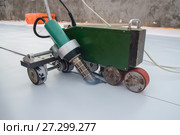 Waterproofing and insulation at construction site, roof sealing process of synthetic pvc membrane with Automatic plastic welder. New protection technology. Стоковое фото, фотограф Сергей Дорошенко / Фотобанк Лори