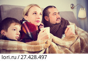 Sick parents and son under blanket. Стоковое фото, фотограф Яков Филимонов / Фотобанк Лори