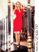 Beautiful blond woman red close-fitting dress. Стоковое фото, фотограф katalinks / Фотобанк Лори