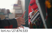 Electrician's hands installing energy system on machinery industry. Стоковое видео, видеограф Константин Шишкин / Фотобанк Лори
