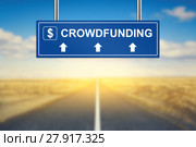 crowdfunding words on blue road sign. Стоковое фото, фотограф Pichet Wissawapipat / PantherMedia / Фотобанк Лори