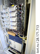 Telecom equipment with many cables and switches in communication center. Стоковое фото, фотограф Losevsky Pavel / Фотобанк Лори