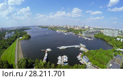 Cityscape with many yachts on moorage in city river bay at summer sunny day. Aerial view videoframe. Стоковое фото, фотограф Losevsky Pavel / Фотобанк Лори