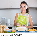 housewife cooking breadcrumbed croquettes. Стоковое фото, фотограф Яков Филимонов / Фотобанк Лори