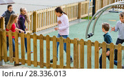 Group of children playing romp game Touch-last outdoors. Стоковое фото, фотограф Яков Филимонов / Фотобанк Лори