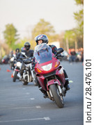 Male motorcyclist riding through cones on gymkhana skill training. Стоковое фото, фотограф Кекяляйнен Андрей / Фотобанк Лори