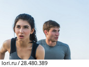 Cheerful Hispanic Caucasian couple running on beach at morning. Стоковое фото, фотограф Kirill Kedrinskiy / Ingram Publishing / Фотобанк Лори