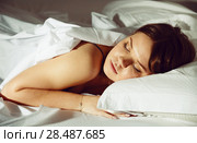 Young female in pygamas is sleeping on bed. Стоковое фото, фотограф Яков Филимонов / Фотобанк Лори