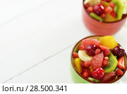Mixed fruit salad on white table with copy-space. Стоковое фото, фотограф Olena Mykhaylova / Ingram Publishing / Фотобанк Лори