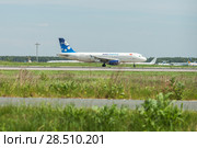 Domodedovo, Russia - MAY 27, 2018: Avia Traffic Company Kyrgyzstan Airbus A320-200 is flying up in  Moscow Domodedovo Airport. Редакционное фото, фотограф Юлия Кузнецова / Фотобанк Лори