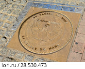 LE MANS, FRANCE - OCTOBER 08, 2017: Fingerprints emblem of company Michel Vaillante and signatures of the winners of races. Редакционное фото, фотограф Irina Kuchugurina/Gaudy / Фотобанк Лори