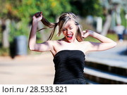 Beautiful and fashion girl with pigtails shouting and dancing. Стоковое фото, фотограф Javier Sánchez Mingorance / Ingram Publishing / Фотобанк Лори