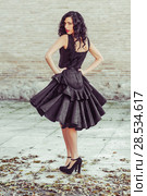 Portrait of beautiful woman, model of fashion, wearing black dress with curly hair. Spanish style. Стоковое фото, фотограф Javier Sánchez Mingorance / Ingram Publishing / Фотобанк Лори