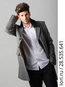 Portrait of handsome man, model of fashion, wearing coat. Studio shot. Стоковое фото, фотограф Javier Sánchez Mingorance / Ingram Publishing / Фотобанк Лори