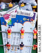 Moscow, Russia - June 8, 2018: Preparing to enter matches of confederations Cup in 2017 and World Cup 2018 in Russia. Fan set - tickets, credit card Visa and id-card on toy football. Редакционное фото, фотограф Papoyan Irina / Фотобанк Лори