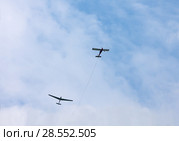 Glider being towed into the sky. Tow rope disengaged. Glider is in free flight. Стоковое фото, фотограф Наталья Николаева / Фотобанк Лори