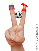 Two fingers in plasticine caps with a soccer ball, isolated on a white background. Fans of Spain and Russia. Стоковое фото, фотограф Элина Гаревская / Фотобанк Лори