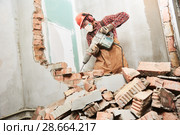 worker with demolition hammer breaking interior wall. Стоковое фото, фотограф Дмитрий Калиновский / Фотобанк Лори