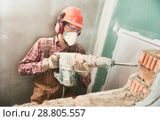 worker with demolition hammer breaking interior wall. Стоковое фото, фотограф Дмитрий Калиновский / Фотобанк Лори