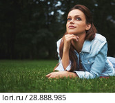 happy Girl lying on the grass. Стоковое фото, фотограф Александр Лычагин / Фотобанк Лори