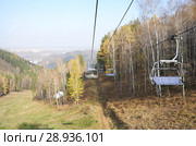 Канатно-кресельный подъемник в Фанпарке "Бобровый лог". Красноярск (2011 год). Редакционное фото, фотограф Сапрыгин Сергей / Фотобанк Лори