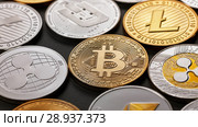 Close-up of shiny gold and silver coins on a dark background. Business and technology concept. Top view. Стоковое фото, фотограф Ярослав Данильченко / Фотобанк Лори