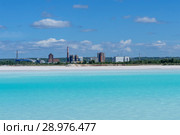 Industrial tailing pond with beautiful blue water on the background of the factory landscape. Стоковое фото, фотограф Евгений Харитонов / Фотобанк Лори