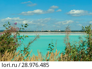 Industrial tailing pond with beautiful blue water on the background of the factory landscape. Стоковое фото, фотограф Евгений Харитонов / Фотобанк Лори