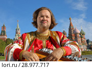 Musician with music instrument gusli. Стоковое фото, фотограф Алексей Кузнецов / Фотобанк Лори