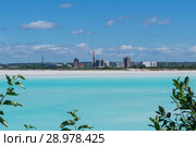 Industrial tailing pond with beautiful blue water on the background of the factory landscape. Стоковое фото, фотограф Евгений Харитонов / Фотобанк Лори