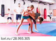 Kids in sportswear exercising self-protection techniques. Стоковое фото, фотограф Яков Филимонов / Фотобанк Лори