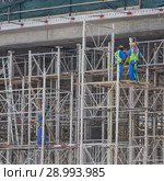 Team of construction worker on construction site. Стоковое фото, фотограф Matej Kastelic / Фотобанк Лори