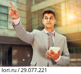 Businessman pointing at something. Стоковое фото, фотограф Яков Филимонов / Фотобанк Лори