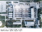 Plant for the production of cement, clinker and gypsum. Tubular rotary kilns. Aerial photography, view vertically down. Стоковое фото, фотограф Андрей Радченко / Фотобанк Лори
