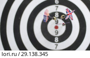 Playing darts on black-white dartboard with five darts. Стоковое видео, видеограф Uladzimir Sitkouski / Фотобанк Лори