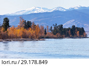 Lake Baikal on a sunny September day. View from the water on the snow-capped mountain range Khamar-Daban. Стоковое фото, фотограф Виктория Катьянова / Фотобанк Лори