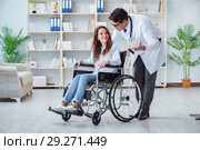 Disabled patient on wheelchair visiting doctor for regular check. Стоковое фото, фотограф Elnur / Фотобанк Лори