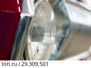 Detail of the front part of a vintage car, headlight and radiator fragment. Стоковое фото, фотограф Евгений Харитонов / Фотобанк Лори