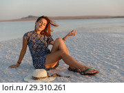happy smiling girl enjoying the sunset, closed her eyes to pleasure, sit on salt. Стоковое фото, фотограф Ирина Мойсеева / Фотобанк Лори