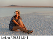 happy smiling girl enjoying the sunset, closed her eyes to pleasure, sit on salt. Стоковое фото, фотограф Ирина Мойсеева / Фотобанк Лори