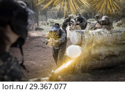impudent teams facing on battlefield in outdoor paintball arena. Стоковое фото, фотограф Яков Филимонов / Фотобанк Лори