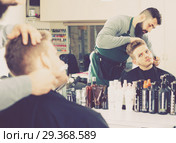 Male hairdresser accurately cutting beard. Стоковое фото, фотограф Яков Филимонов / Фотобанк Лори