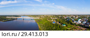 A panorama from a height, a typical small city in central Russia and the river Vyatka with railroad bridge. Стоковое фото, фотограф Mikhail Starodubov / Фотобанк Лори