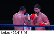 KAZAN, RUSSIA - OCTOBER 27, 2018: The wrestlers In action at Fighting by the rules TNA. boxers try to hit each other. Live at the TATNEFTARENA on OCTOBER 27, 2018 in KAZAN, RUSSIA. Редакционное видео, видеограф Константин Шишкин / Фотобанк Лори