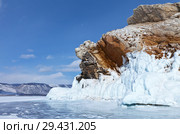 Baikal Lake in winter. Strait Small Sea (Maloe More). Beautiful icy rocks of bizarre shape on the edge of the stone island of Borga- Dagan. Стоковое фото, фотограф Виктория Катьянова / Фотобанк Лори