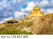 Beautuful View to Ancient Orthodox Church in mount in antique cave city Uplistsikhe. The Uplistsikhe 9th-10th century three-nave basilica and vale of Mtkvari river, Shida Kartli, Gori, Georgia. Стоковое фото, фотограф Алексей Ширманов / Фотобанк Лори