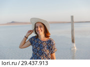 happy smiling girl in white hat enjoying sun, expanse of Bascunchak salt lake. Стоковое фото, фотограф Ирина Мойсеева / Фотобанк Лори