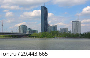 Вид на самое высокое здание Вены - DC Tower солнечным апрельским днем. Австрия (2018 год). Редакционное видео, видеограф Виктор Карасев / Фотобанк Лори