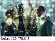 A group of friends celebrate the new year. Стоковое фото, фотограф Женя Канашкин / Фотобанк Лори
