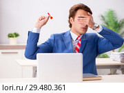 Businessman throwing dart in business concept. Стоковое фото, фотограф Elnur / Фотобанк Лори